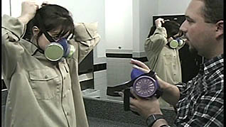 Workers putting on breathing masks