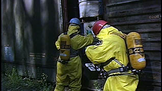 Two men working with hazardous materials