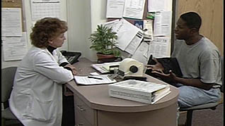 A man speaking with his doctor