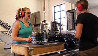 Two employees with headphones on