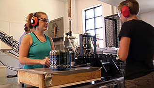 Two employees with headphones on