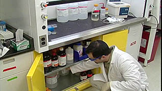 A man grabbing chemicals