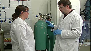 A man showing an employee the dangers of explosives