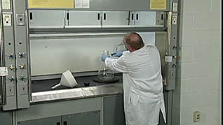 A man properly cleaning glassware