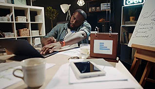 Man working at a messy desk