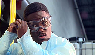 A man fixing his safety glasses