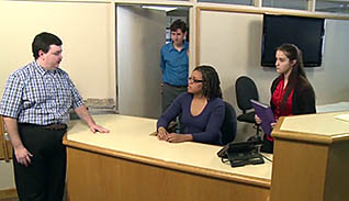 Man talking to two women