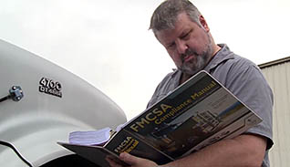 Man reading a manual