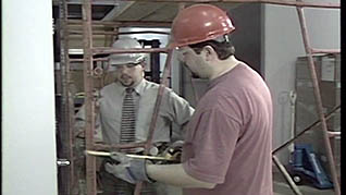 Men checking a scaffold