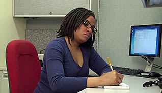 Woman writing something down