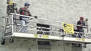 Two men properly using the guard rails