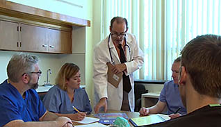 A doctor talking to nurses
