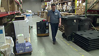 A man moving products