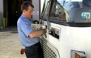 Man installing part into truck