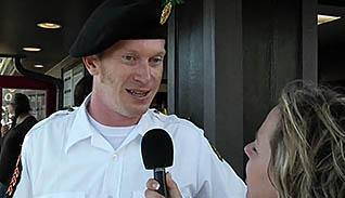Man in uniform talking on a microphone