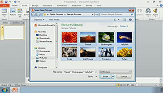 A screenshot of images being added in the "Adding Graphics in PowerPoint 2010" training video