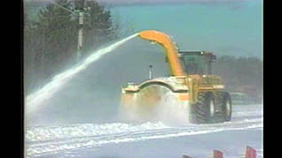 A man plowing snow