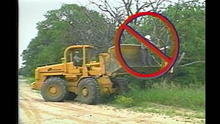 a man improperly using a wheel loader