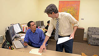 Two men talking in an office