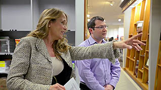 Man and woman talking in office