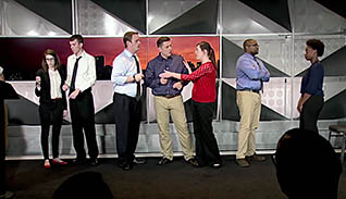 Group of people talking on a stage