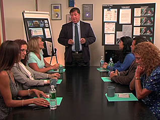 Man talking to employees in meeting