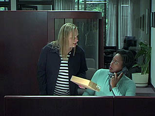 Two women talking in office