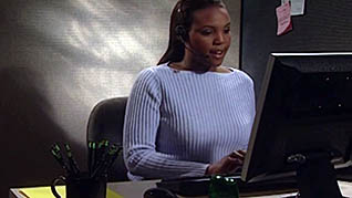 An employee working on the computer in the communication skills training video