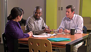 Three co-workers having a meeting