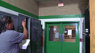 A man going out the fire exit