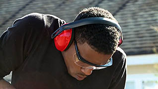 Man wearing glasses and headphones