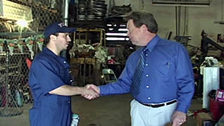 Two co-workers shaking hands