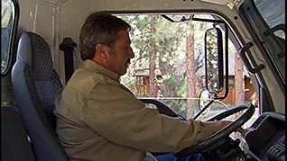 A driver checks his vehicle settings during his pre-trip inspection